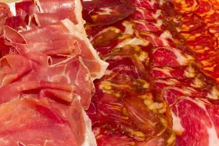 Plate with various cold cuts and ham sausageの写真素材