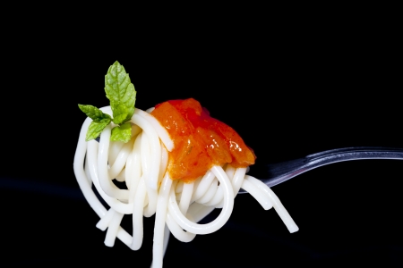 Close up of a fork with spaghetti and mintの写真素材