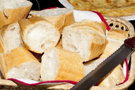 Bread cut on a table with the bottom potato omelette