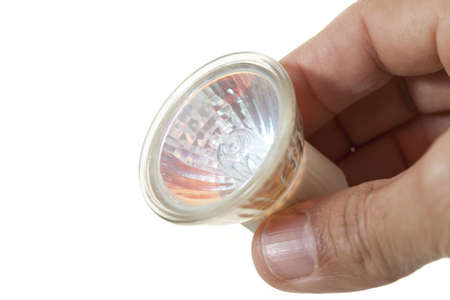 Person with a halogen bulb in hands