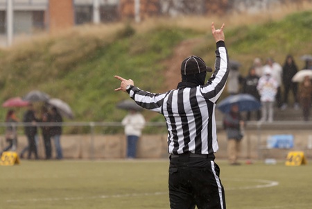 Closeup of the back of a football referee