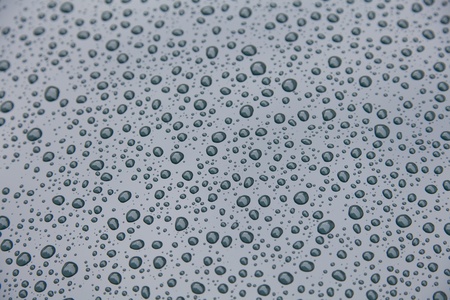 Delicate drops of water on funds of colorの写真素材