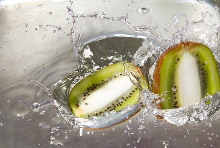 Kiwis falling into the water and splashing waterの写真素材