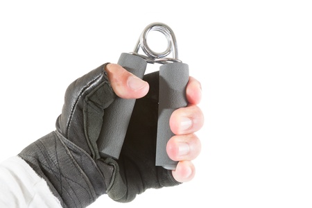 Man holding a hand trainer isolated on whiteの写真素材