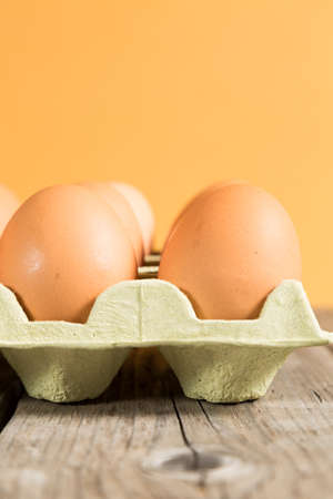 Fresh eggs in a cardboard egg carton recycling