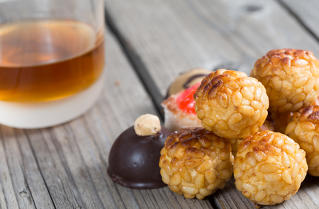 Delicious wine panellet assorted candy on a wooden tableの写真素材