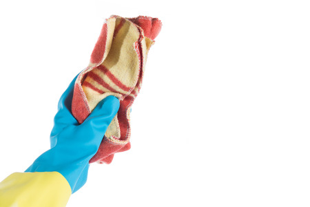 Hand with glove and a cloth cleans dustの写真素材