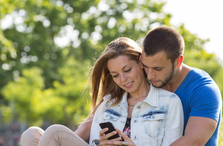 Couple weds at messages in your mobile phoneの写真素材