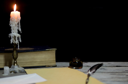 Old writing desk with its chandelier and penの写真素材