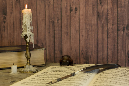 Table with the ancient book of human anatomyの写真素材