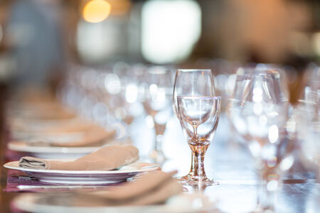 Restaurant with table settings for a dinner partyの写真素材