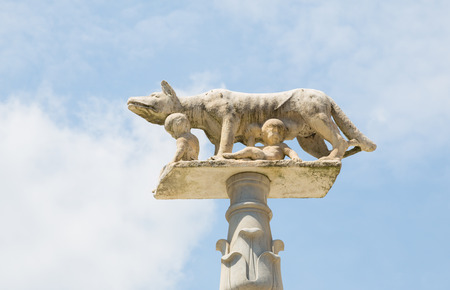 Romulo and Remo statues on a pedestal located in front of Santa Maria della Scalla church in Siena, Tuscany region, Italyの写真素材
