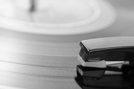 Old turntable with a record playingの写真素材