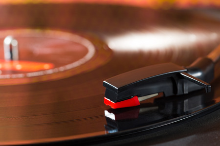 Old turntable with a record playing
