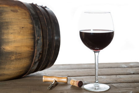 Glass of red wine with oak