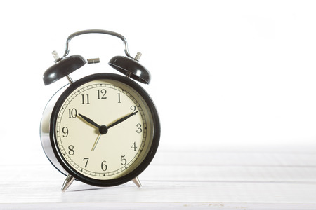 Classic alarm clock with white background