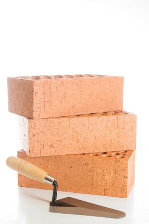 Building brick red on white backgroundの写真素材