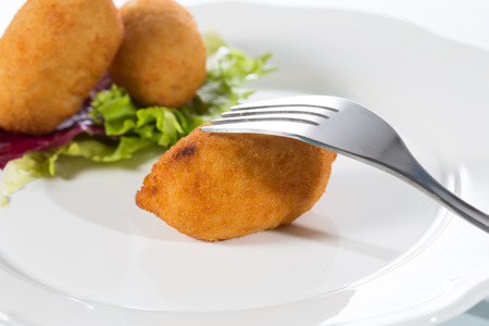 Delicious homemade croquettes on your plate with salad