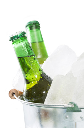 Fresh beer in a cooler with iceの写真素材