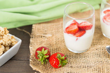 Natural yoghurt with wild strawberries and fresh cheeseの写真素材