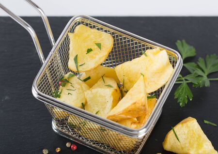Fries seasoned with pepper and parsley and salt