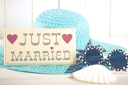 Just married sign with things to go on vacation to the beachの写真素材