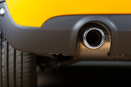 Sport exhaust in a car stopped orangeの写真素材