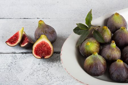 Ripe figs ready to eat a wooden table