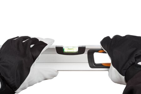 Worker with gloves and a level on a white background