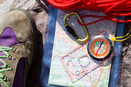 Exit to the mountain with map and compass ropes