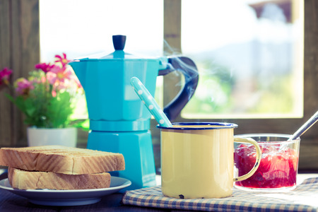 Coffee with some toast with homemade jam window wingの写真素材