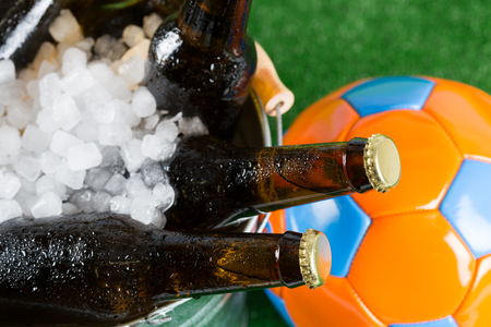 Football with a beer in a cold bucketの写真素材