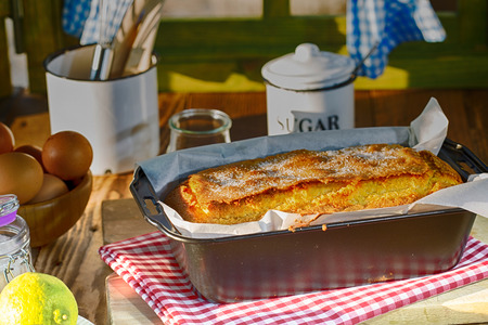 Homemade yogurt cake with a few lemon peel