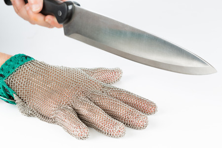 Metal safety mesh glove with a knifeの写真素材