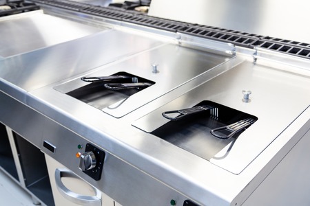 Industrial fryer built in stainless in a kitchen