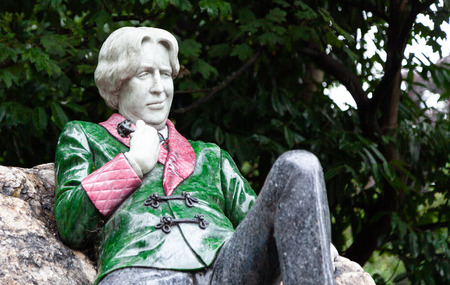 Dublin, Ireland August 17, 2018: Sculpture of writer Oscar Wilde in Merrion Square. The artwork by Danny Osborne was unveiled in 1997. The art shows Wilde reclining on a large boulder.のeditorial素材