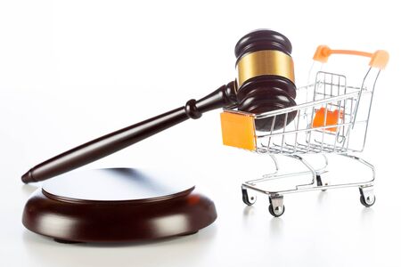 Shopping cart with a gavel of justiceの写真素材