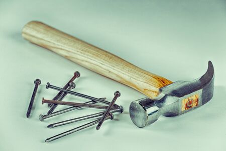 Construction hammer with nails and white backgroundの写真素材