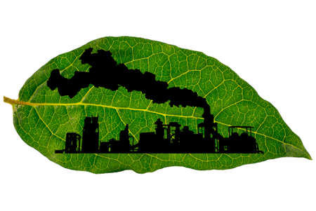 Silhouette of industrial factory on a green leafの写真素材