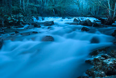 small waterfall in the evening with long exposure effectの写真素材
