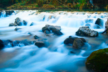 small waterfall in the evening with long exposure effectの写真素材