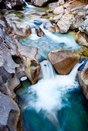 Falls from several cascades in a mountain riverの写真素材