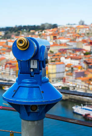 a telescope to explore the city on the viewing platformの写真素材