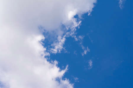 light white clouds against blue skyの写真素材
