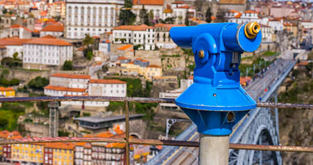 a telescope to explore the city on the viewing platformの写真素材