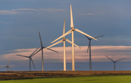 Clean and renewable energy. Area with huge eolian turbines used for converrting the wind into...