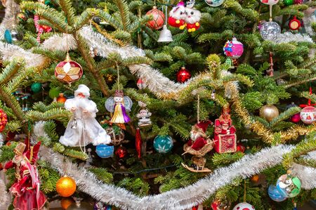 Christmas tree decorated with colorful balls and ornaments.の写真素材