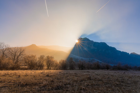 Beautiful sunrise over the mountains in a cold autumn morning.