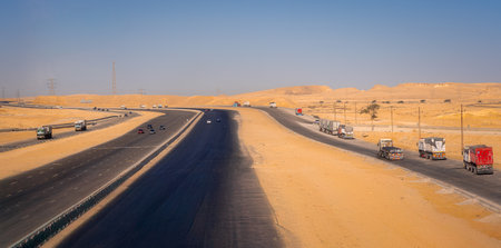 Traffic on the road in the middle of the desert.の写真素材