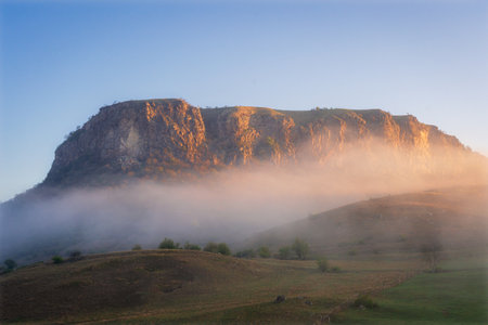 Landscape with morning fog on the hillside.の写真素材